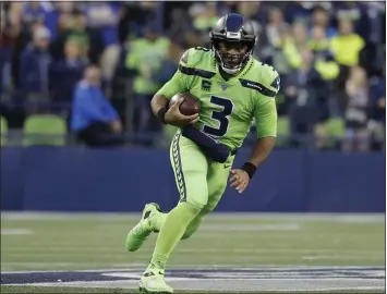  ?? ELAINE THOMPSON – THE ASSOCIATED PRESS ?? Quarterbac­k Russell Wilson, who led the Seahawks to a victory over the Rams on Oct. 3, has completed 73percent of his passes and leads the NFL in passer rating at 126.3. He leads Seattle against the struggling Cleveland Browns today.