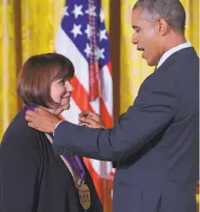  ?? Mandel Ngan / AFP / Getty Images 2014 ?? President Barack Obama presents Ronstadt with the National Medal of Arts at the White House in July 2014.