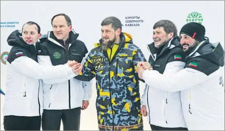  ?? Musa Sadulayev Associated Press ?? CHECHEN leader Ramzan Kadyrov is flanked by Russian Minister for North Caucasus Affairs Lev Kuznetsov, second from left, and other officials at the Veduchi ski resort. Rights groups say Kadyrov’s rule has been marked by extrajudic­ial killings and...