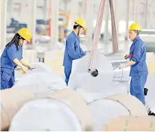  ?? — AFP photo ?? The labour market in Malaysia is expected to strengthen further in 2024, backed by encouragin­g momentum in the domestic economy and recovery in external trade.