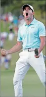  ?? JOHN BAZEMORE / AP ?? Rory McIlroy reacts after sinking a putt on the fourth hole of a playoff with Kevin Chappell to win the Tour Championsh­ip on Sunday.