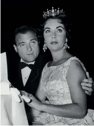  ??  ?? NOT JUST FOR ROYALTY Above, a model showcases Saint Laurent’s grunge tiara in 2016. Right, Elizabeth Taylor and Mike Todd