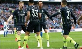  ??  ?? Kevin De Bruyne (left) celebrates after setting up Gabriel Jesus for his early goal against Brighton. Photograph: Charlotte Wilson/Offside/Getty Images