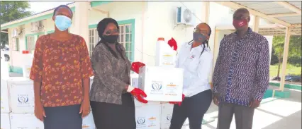  ??  ?? Helping hand… Agricultur­al officials Laudika Muyunda, Violet Simataa and Richard Nchindo receive the donation from Loide Uahengo of the Namibian Agronomic Board.