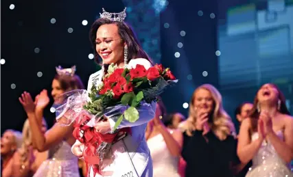  ?? ?? Miss Dogwood, Ebony Mitchell of Harrison, is crowned as Miss Arkansas during the pageant last Saturday night at the Robinson Center in Little Rock. (Arkansas Democrat-Gazette/Staci Vandagriff)