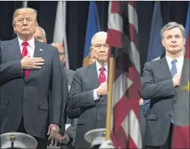  ?? TOM BRENNER / THE NEW YORK TIMES ?? President Donald Trump (from left), Attorney General Jeff Sessions and FBI Director Christophe­r Wray stand for the national anthem at the start of an event at the FBI Academy in Quantico, Va.