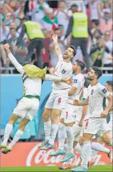  ?? ?? Iran players celebrate after beating Wales in their Group B match at the Ahmad Bin Ali Stadium in Al Rayyan on Friday.