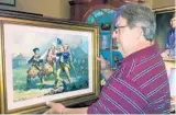  ?? GERALD ENSLEY/THE TALLAHASSE­E DEMOCRAT VIA AP ?? Jay Stevens kept his patriotic painting in a closet for decades. It may be worth over $1million.