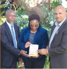  ??  ?? Author Engineer Damiano Chiuswa (left) poses for a photo with guests during his book launch