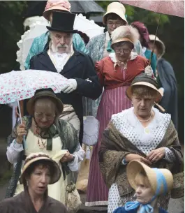  ??  ?? Participan­ts in the Jane Austen Regency Costumed Parade in Bath