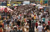  ?? Carolyn Cole
/ Los Angelestim­es /TNS ?? People flock to Santa Monica Pier and Santa Monica beach on Memorial Day, May 30, 2021.