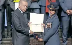  ?? Supplied ?? PRESIDENT Recep Tayyip Erdoğan of Türkiye hands over the medal and certificat­e to Brigadier Vimla Moodley. |