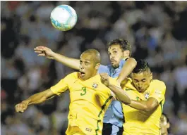  ?? MATILDE CAMPODONIC­O/ASSOCIATED PRESS ?? Brazil’s Miranda, left, and Marquinhos, right, fight for the ball with Uruguay’s Christian Stuani during a World Cup qualifying match in Montevideo, Uruguay, Brazil won 4-1.