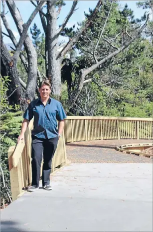  ?? Photo: JESS LEE ?? New direction: Puketapapa Local Board member Michael Wood walks on the newly opened walking and cycling track at Lynfield Reserve.