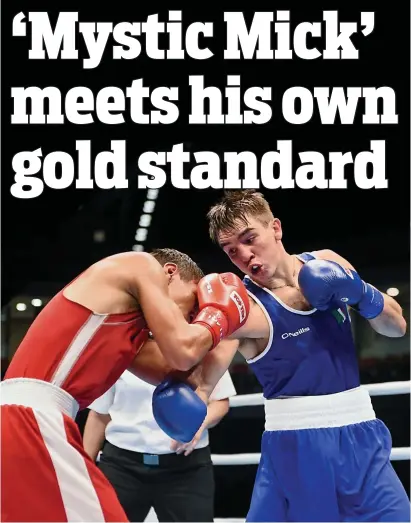  ??  ?? Action hero: Michael Conlan (right) lands a shot during his World final win over Murodjon Akhmadalie­v