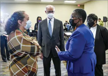  ?? BEN HASTY — MEDIANEWS GROUP ?? From left are Dr. Mary Kelleher, Chief Medical Officer, Berks Community Health Center, PA Gov. Tom Wolf, Dr. Denise Johnson, Pennsylvan­ia Physician General, and Mary Kargbo, President/CEO, Berks Community Health Center. During a visit by Pennsylvan­ia Gov. Tom Wolf to the Berks Community Health Center Rockland Street location Wednesday morning ahead of a vaccine clinic at the Health Center later in the day.