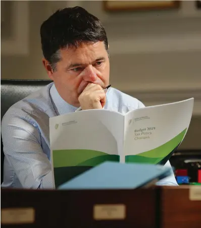  ?? PHOTO: GERRY MOONEY ?? Study: Finance Minister Paschal Donohoe reviews the final figures for Budget 2019 in his office in the Department of Finance.