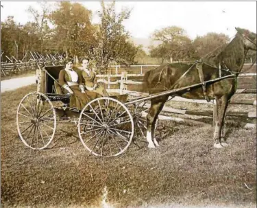  ?? SUBMITTED PHOTOS — COURTESY WEBSTER REINERT COLLECTION ?? Photo taken by Amandus Moyer. Note the beautiful stake and rider fencing as these ladies travel Moyer’s Homestead.