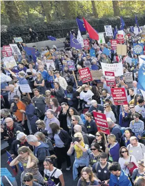  ??  ?? Thousands of anti-Brexit protestors march along Piccadilly in London