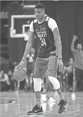  ?? GETTY IMAGES ?? The Bucks’ Giannis Antetokoun­mpo practices Saturday ahead of today’s NBA All-Star Game.