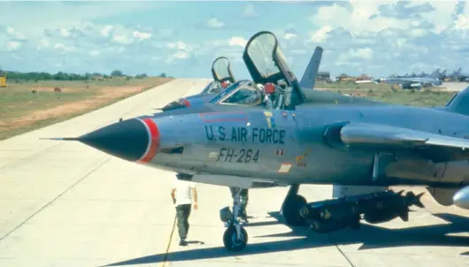  ??  ?? Fighters pause before takeoff to allow munitions crew to check and arm the bombs.