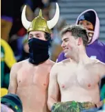  ?? ASSOCIATED PRESS ?? Vikings fans go shirtless before the Green Bay-Minnesota game Sunday at Lambeau Field.