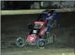  ?? RICH KEPNER - FOR MEDIANEWS GROUP ?? Chris Windom, rear, makes a lastlap pass of Tyler Courtney (7) to win the Ken Brenn USAC Midget Masters race during Thunder on the Hill racing at Grandview on July 30.