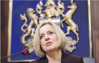  ??  ?? Alberta Premier Rachel Notley speaks to cabinet members about an 8.7 percent oil production cut to help deal with low prices.