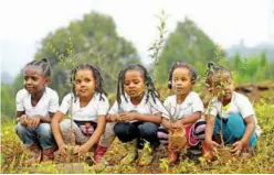  ?? Agence France-presse ?? Young Ethiopian girls take part in a national tree-planting drive in the capital Addis Ababa.