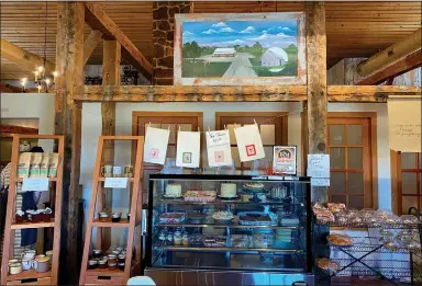  ?? Special to the Eagle Observer/DANIEL BEREZNICKI ?? Guests at The Wooden Spoon are welcomed with a display of desserts and baked goods, as well as a painting portraying the restaurant and an old Michigan barn.