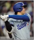  ?? (AP/Gregory Bull) ?? Los Angeles Dodgers’ Shohei Ohtani watches his groundout Saturday during a game against the San Diego Padres in San Diego. Ohtani didn’t play in the 4-0 loss to the Padres on Sunday.