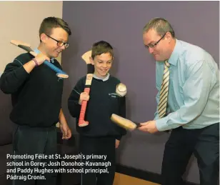  ??  ?? Promoting Féile at St. Joseph’s primary school in Gorey: Josh Donohoe-Kavanagh and Paddy Hughes with school principal, Pádraig Cronin.