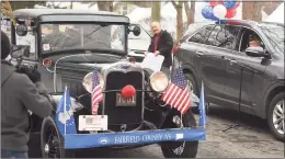  ??  ?? An antique car helps celebrate World War II veteran Nick Samodel’s 100th birthday on Sunday as part of a car parade.