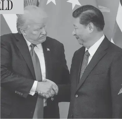  ?? FRED DUFOUR / AFP / GETTY IMAGES ?? U.S. President Donald Trump shakes hands with Chinese President Xi Jinping at the Great Hall of the People in Beijing. Trump addressed China with a gentler tone than he’d used during his presidenti­al campaign.