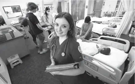  ?? GARY KAZANJIAN/AP ?? Emma Champlin, a first-year nursing student in California, said the pandemic has given her a chance to learn and apply critical-care skills.