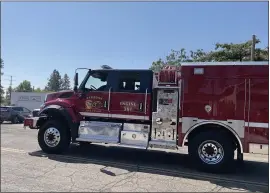  ??  ?? Cal Fire-Butte County’s wild land fire engine 381, stationed at Station 81in Paradise, departs Tuesday in Paradise.