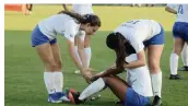  ?? BILL DALEY For the Miami Herald ?? Teammates console Kamila Mercado after Cypress Bay lost in the Class 7A championsh­ip game on Friday.