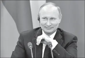  ?? AP/YURI KADOBNOV ?? Russian President Vladimir Putin takes a question Wednesday in Sochi, Russia, during a news conference with Italian Prime Minister Paolo Gentiloni. Putin offered to share a “record” of the meeting last week between President Donald Trump and Russian...