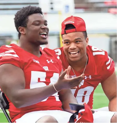  ?? CHRIS KOHLEY / MILWAUKEE JOURNAL SENTINEL ?? Chris Orr (left) and Arrington Farrar share a laugh at Wisconsin’s football media day at Camp Randall Stadium Wednesday.