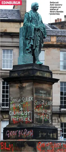  ??  ?? Defaced: Anti-slavery slogans on statue of Henry Dundas yesterday