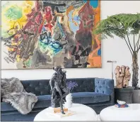  ?? LAUREN SILBERMAN, DRAKE/ANDERSON VIA AP ?? This photo shows a a New York living room designed by Drake/Anderson, where large-scale art plays a starring role in the décor scheme.