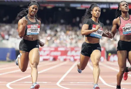  ?? AP ?? Shelly-Ann Fraser-Pryce (left) of Jamaica celebrates after winning the women’s 100 metres in 10.98 seconds at the IAAF Diamond League meet at the London Stadium yesterday. American Dezerea Bryant (centre) was second in 11.04, while Jamaica’s Jonielle Smith (right) took third in a personal best 11.07.