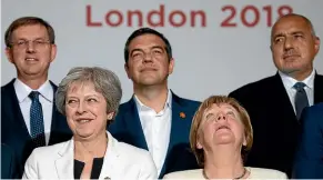  ??  ?? Slovenia’s Prime Minister Miro Cerar, Britain’s Prime Minister Theresa May, Greece’s Prime Minister Alexis Tsipras, Germany’s Chancellor Angela Merkel and Bulgaria’s Prime Minister Boyko Borissov prepare to take part in the family photo during the...