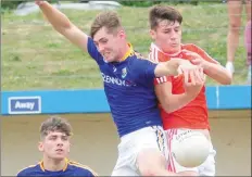  ??  ?? Ryan Walsh, Louth and Cian Nolan, Longford battle for possession.