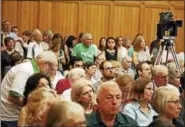  ?? CHRISTINE STUART — CTNEWSJUNK­IE ?? People attend a hearing Monday about the Republican health care plan.