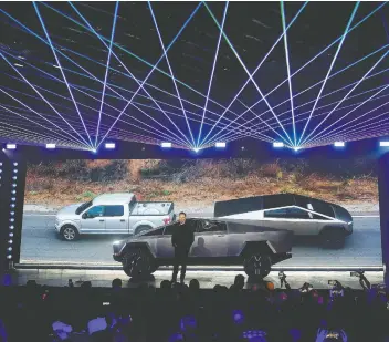  ?? RINGO H.W. CHIU/AP FILES ?? Tesla CEO Elon Musk introduces the Cybertruck at Tesla’s design studio in Hawthorne, Calif, last week. The truck has ignited a frenzy over electric pickups but the big question is who will buy them.