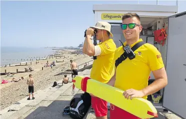  ??  ?? RNLI lifeguards Tom King and Alex Wilmshurst on Sheerness beach last year