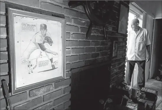  ?? Photograph­s by Mark Boster For The Times ?? STAN WILLIAMS, standing in the doorway of his Lakewood home, can remember every pitch he threw against Jim Davenport before he walked him in 1962.