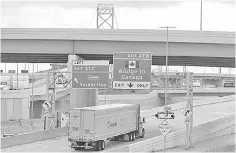  ?? — Reuters photo ?? A commercial truck exits the highway for the Ambassador Bridge to Canada, in Detroit, Michigan US. Talks entered a crucial phase this week after the US and Mexico reached a bilateral deal, paving the way for Canada to rejoin talks to salvage the 24-year-old accord that underpins US$1.2 trillion in annual North American trade.