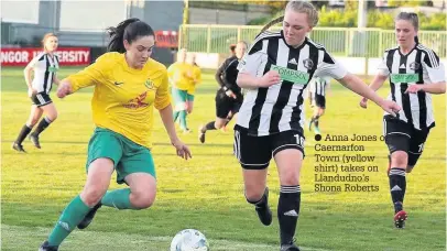  ??  ?? ● Anna Jones of Caernarfon Town (yellow shirt) takes on Llandudno’s Shona Roberts